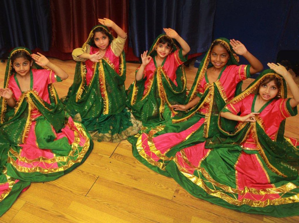 Girls posing for picture in traditional Diwali attire. 