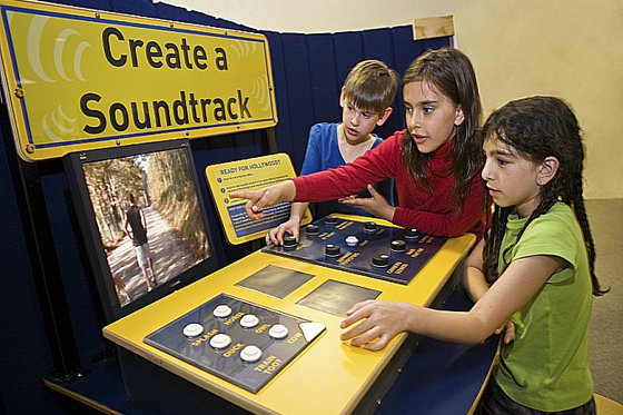 Children creating a soundtrack with exhibit component. 