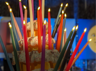 Photos of candles on a cake.