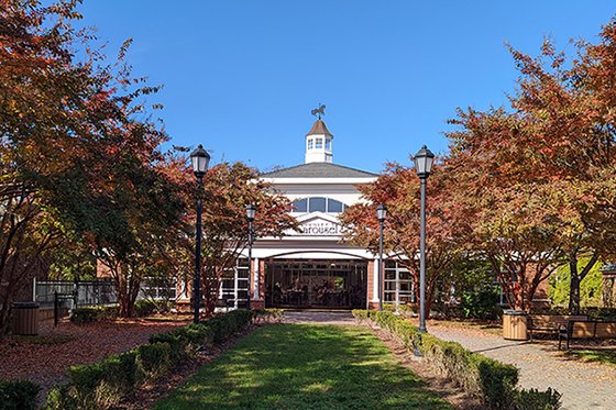 Photo of the lawn in front of Nunleys Carousel, featuring the front of the building.